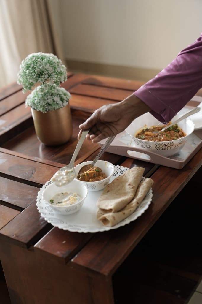Freshly prepared home-style food and rotis ready to serve
